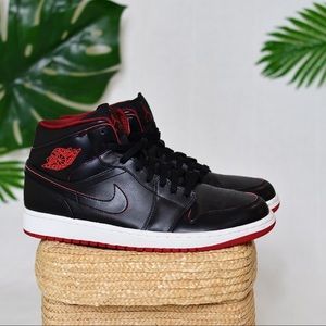 JORDAN 1 MID BRED BLACK AND RED